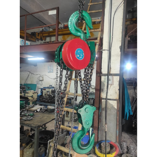 Professional technician repairing a manual chain hoist at Shreenath Enterprises workshop in Darukhana Mumbai